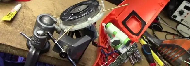 Vacuum cleaner repair parts and tools on a workbench in Lincoln, NE